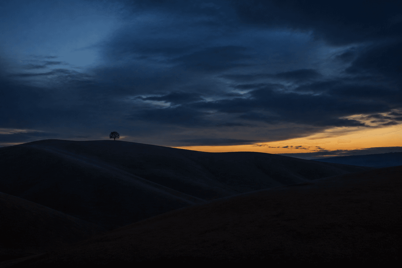 Dark hills and a warm afterglow. Placeholder still.